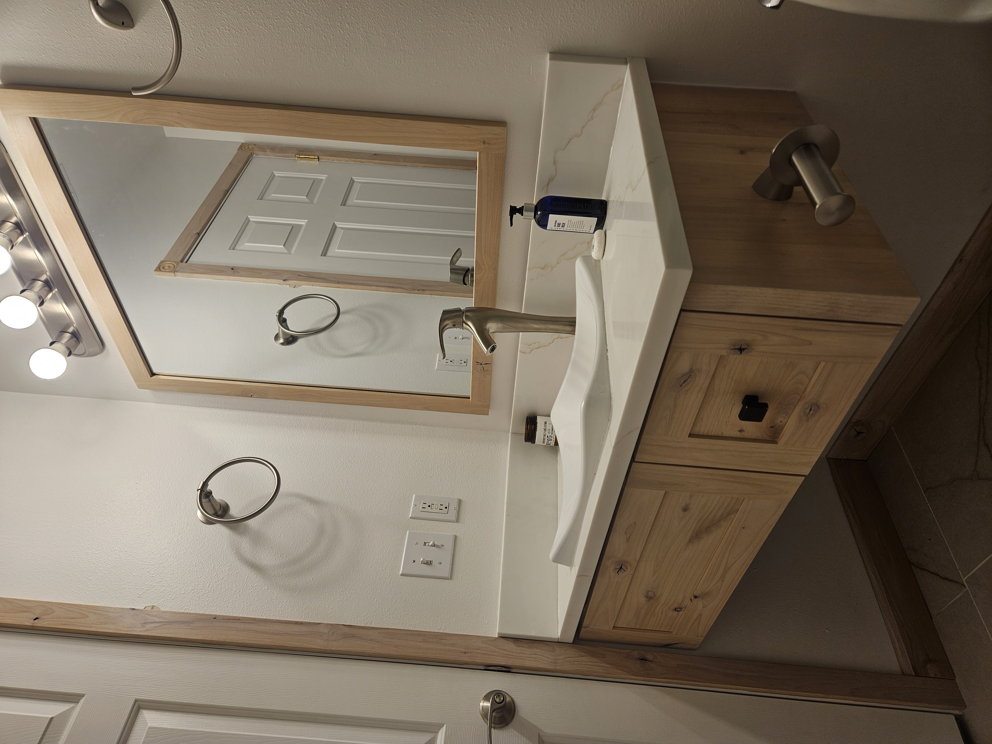 Completed custom vanity mirror and trim in second bathroom